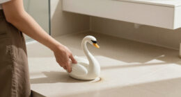 She Used A Ceramic Swan To Hide This Major Bathroom Eyesore